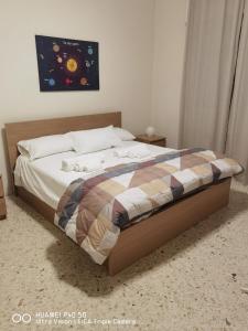 Postel nebo postele na pokoji v ubytování B&B PARCO 2 GIUGNO