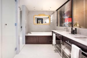 
a bathroom with a sink and a mirror at Charisma De Luxe Hotel in Kuşadası
