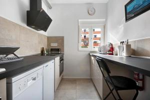 Kuchyň nebo kuchyňský kout v ubytování Apartment Fantastico 4