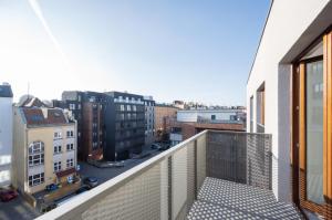 a balcony with a view of a city at Icon Apartaments Drobnera studio in Wrocław