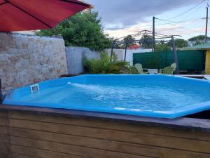 a large blue bath tub sitting on top of a patio at Tropic Arth Paradise in Port-Louis