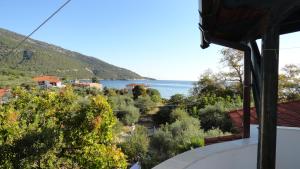 a view of the ocean from a house at Blue Bay Beach Hotel in Koinyra