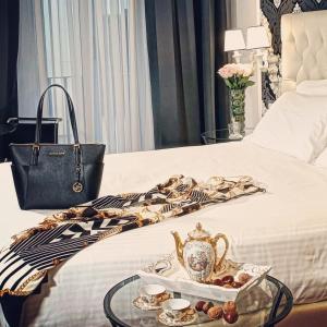 A bed or beds in a room at NAVONA VITA SUITES