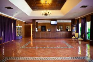 a lobby with a waiting area in a hotel at Vila Gale Albacora in Tavira +55 photos