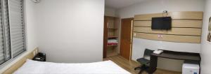 Postel nebo postele na pokoji v ubytování Hotel Lisbor