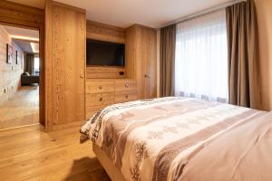 Postel nebo postele na pokoji v ubytování Haus Mirador by Zermatt Premium Apartments
