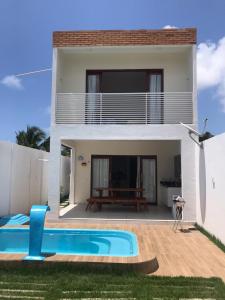 Bazén v ubytování Casa de praia completa em Milagres nebo v jeho okolí