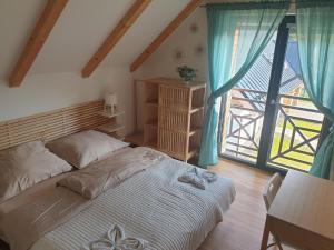 Posteľ alebo postele v izbe v ubytovaní Ski Chalet Klínovec