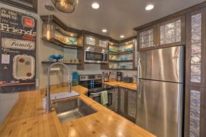 a kitchen with a stainless steel refrigerator and wooden counters at Walk to Giant Steps Lift - Brian Head Condo in Brian Head