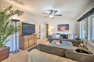 a living room with a couch and a tv at John Day Lakehouse with a Great Outdoor Space! in John Day