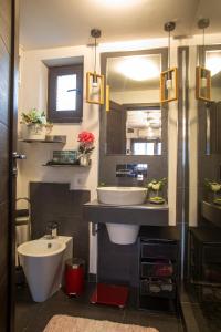 a bathroom with a sink and a toilet at Amo Bucharest in Bucharest +27 photos