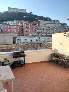 a balcony with a view of a city at La Terrazza sui Quartieri in Naples