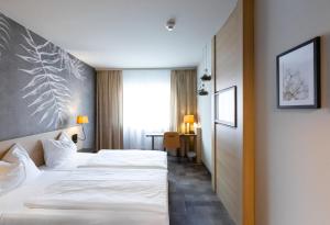 Postel nebo postele na pokoji v ubytování Hotel Das Himberg