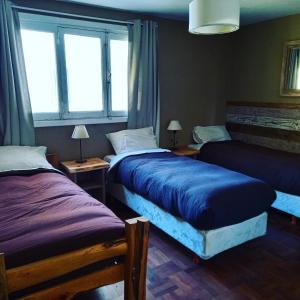 Postel nebo postele na pokoji v ubytování Bariloche Hostel