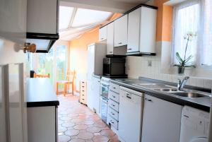 Kuchyň nebo kuchyňský kout v ubytování Comfortable rooms