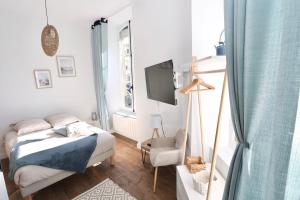 Postel nebo postele na pokoji v ubytování Napoléon Gare 1 STUDIO Lumineux ByLocly + 29 fotografií