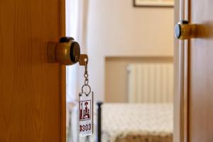 Posteľ alebo postele v izbe v ubytovaní Hotel Trasimeno