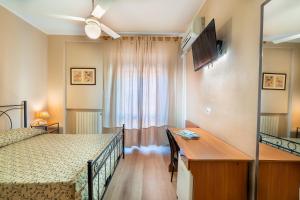 Posteľ alebo postele v izbe v ubytovaní Hotel Trasimeno