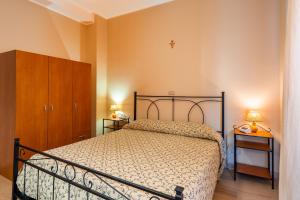 Posteľ alebo postele v izbe v ubytovaní Hotel Trasimeno