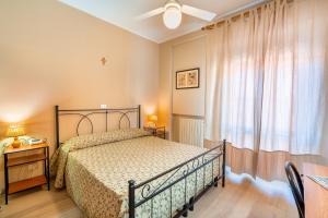 Posteľ alebo postele v izbe v ubytovaní Hotel Trasimeno
