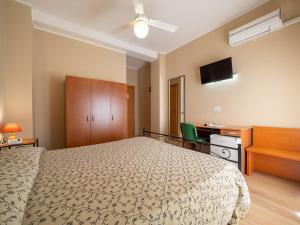 Posteľ alebo postele v izbe v ubytovaní Hotel Trasimeno