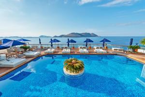 a swimming pool with a view of the ocean at Meis Exclusive Hotel in Kaş