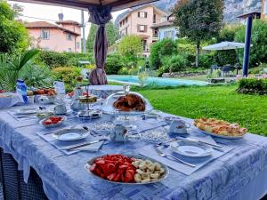 a table with a buffet of food on it at Villa Laura in Lierna