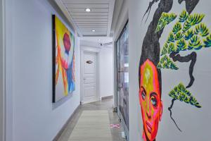 a hallway with paintings on the walls at Meis Exclusive Hotel in Kaş