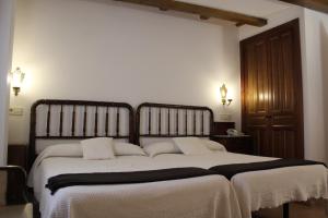 Lova arba lovos apgyvendinimo įstaigoje Hotel La Villa