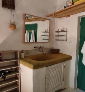 a bathroom with a sink and a mirror at Villa Fontilha in Usclas-lʼHérault +77 photos