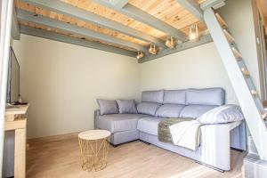 a living room with a couch and a table at Lys in Sierra Nevada