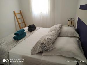 Posteľ alebo postele v izbe v ubytovaní La Roqueta completo en pleno centro