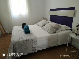 Posteľ alebo postele v izbe v ubytovaní La Roqueta completo en pleno centro