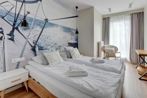 Posteľ alebo postele v izbe v ubytovaní Wave Apartments - Powstańców Wielkopolskich