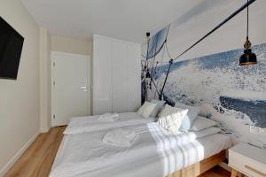 Posteľ alebo postele v izbe v ubytovaní Wave Apartments - Powstańców Wielkopolskich