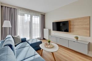 Televízia a/alebo spoločenská miestnosť v ubytovaní Wave Apartments - Powstańców Wielkopolskich