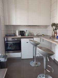 Kuchyňa alebo kuchynka v ubytovaní Apartman Sweet penthouse self check-in