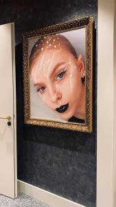 a picture of a woman with makeup on her face at The Gold Bank in Prague