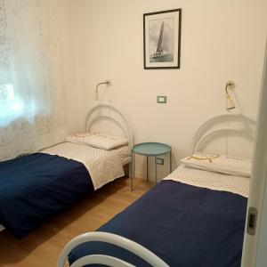 Postel nebo postele na pokoji v ubytování Rio Taglio