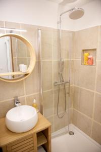 A bathroom at CHARMING Parisian Apartment WITH AIR CONDITIONING - CLIMATISATION & 2 BEDROOMS - Batignolles PARIS