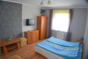 Posteľ alebo postele v izbe v ubytovaní Ośrodek Pegaz