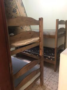 Ένα ή περισσότερα κρεβάτια σε δωμάτιο στο Casa Indaiá Bertioga