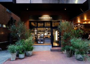 a store front of a moroccan shop with plants in front at THE KNOT TOKYO Shinjuku in Tokyo +28 photos