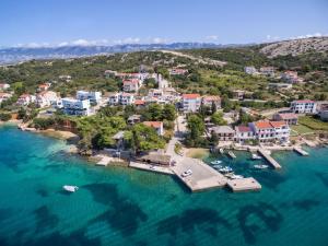 an aerial view of a resort on a body of water at Rooms Zdravko in Stara Novalja