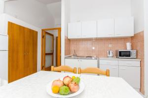 Kuchyň nebo kuchyňský kout v ubytování Apartments Zoran