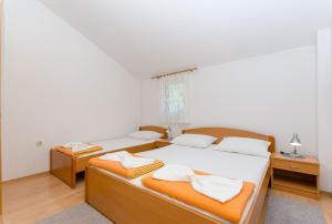 Postel nebo postele na pokoji v ubytování Apartments Zoran