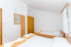 Postel nebo postele na pokoji v ubytování Apartments Zoran