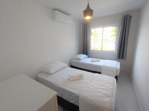 Katil atau katil-katil dalam bilik di Palm Village Acqua - Apartamento Premium - Em frente à piscina - Porto de Galinhas +68 gambar