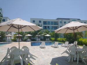 Kolam renang di atau dekat dengan Palm Village Acqua - Apartamento Premium - Em frente à piscina - Porto de Galinhas
