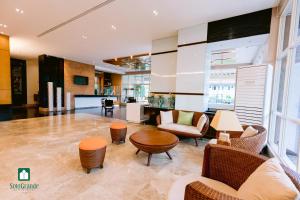 a living room with chairs and a table at Sotogrande Hotel and Resort in Mactan